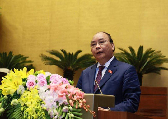 Thủ tướng Nguyễn Xuân Phúc tại phiên khai mạc sáng 22/10. Ảnh: NLDO