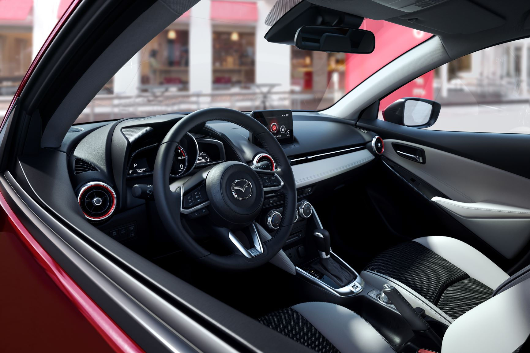 Mazda2 có hệ thống điều hòa tự động, khởi động bằng nút bấm, hệ thống giải trí CD, radio, 6 loa.
