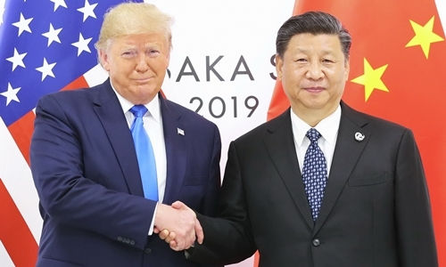 Tổng thống Mỹ Trump (trái) và Chủ tịch Trung Quốc Tập Cận Bình tại Nhật hồi tháng 6. Ảnh: AFP.