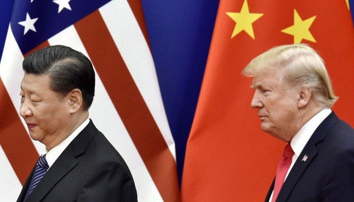 Chủ tịch Trung Quốc Tập Cận Bình (trái) và Tổng thống Mỹ Donald Trump - Ảnh: Kyodo.