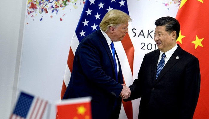 Tổng thống Mỹ Donald Trump (trái) và Chủ tịch Trung Quốc Tập Cận Bình trong cuộc gặp ở Osaka, Nhật Bản, tháng 6/2019 - Ảnh: Reuters.