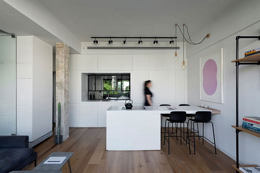 Nhà bếp và phòng ăn tối thiểu chung thành một, tạo ra một không gian hài hòa.