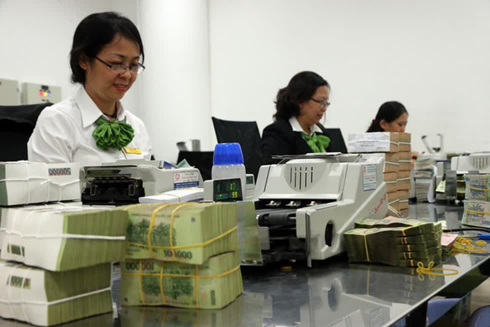 Vietcombank báo lãi gần 11.000 tỷ trong 6 tháng đầu năm. Ảnh: Thanh Niên.