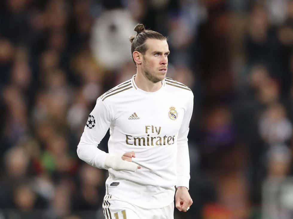   Đồng hạng 4. Gareth Bale - 41 triệu USD. Từng là cầu thủ đắt giá nhất thế giới, cầu thủ xứ Wales này tuy không còn được yêu thích ở Real Madrid, nhưng vẫn kiếm được khoản tiền khổng lồ ở Tây Ban Nha. Ngoài tiền lương và các khoản quảng cáo, phí đăng bài trên Instagram cũng có thể giúp cầu thủ này kiếm được 185.000 USD cho mỗi lần đăng. Ảnh: Getty  