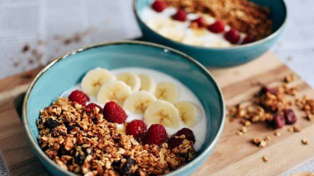 106956648-1633702336751-granola-and-yogurt-bowls-healthy-breakfast-fresh-fruits-raspberries-banana-slices-breakfast-bowls_t20_xvzxkv.jpg