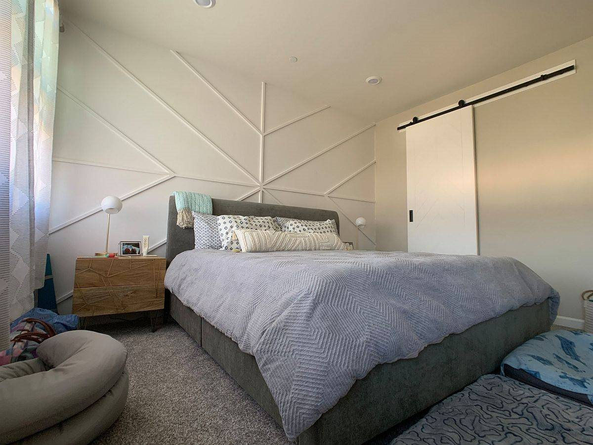 geometric-accent-wall-in-white-leaves-the-color-scheme-of-this-small-bedroom-undisturbed-69069.jpg