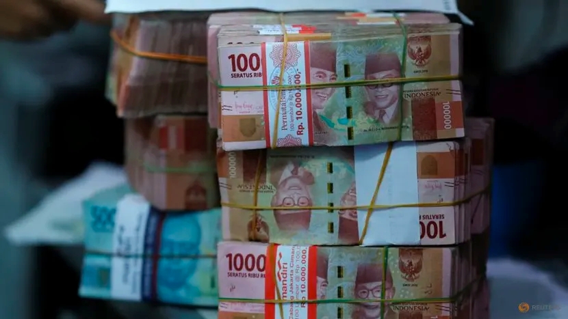Đồng Rupiah của Indonesia bắt đầu sụp đổ trước đồng USD - Ảnh 1.